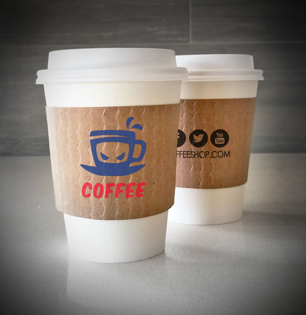 Kraft cup custom cup sleeves printed with two colors on front and one color on back placed on 2 white paper cups placed on a table top