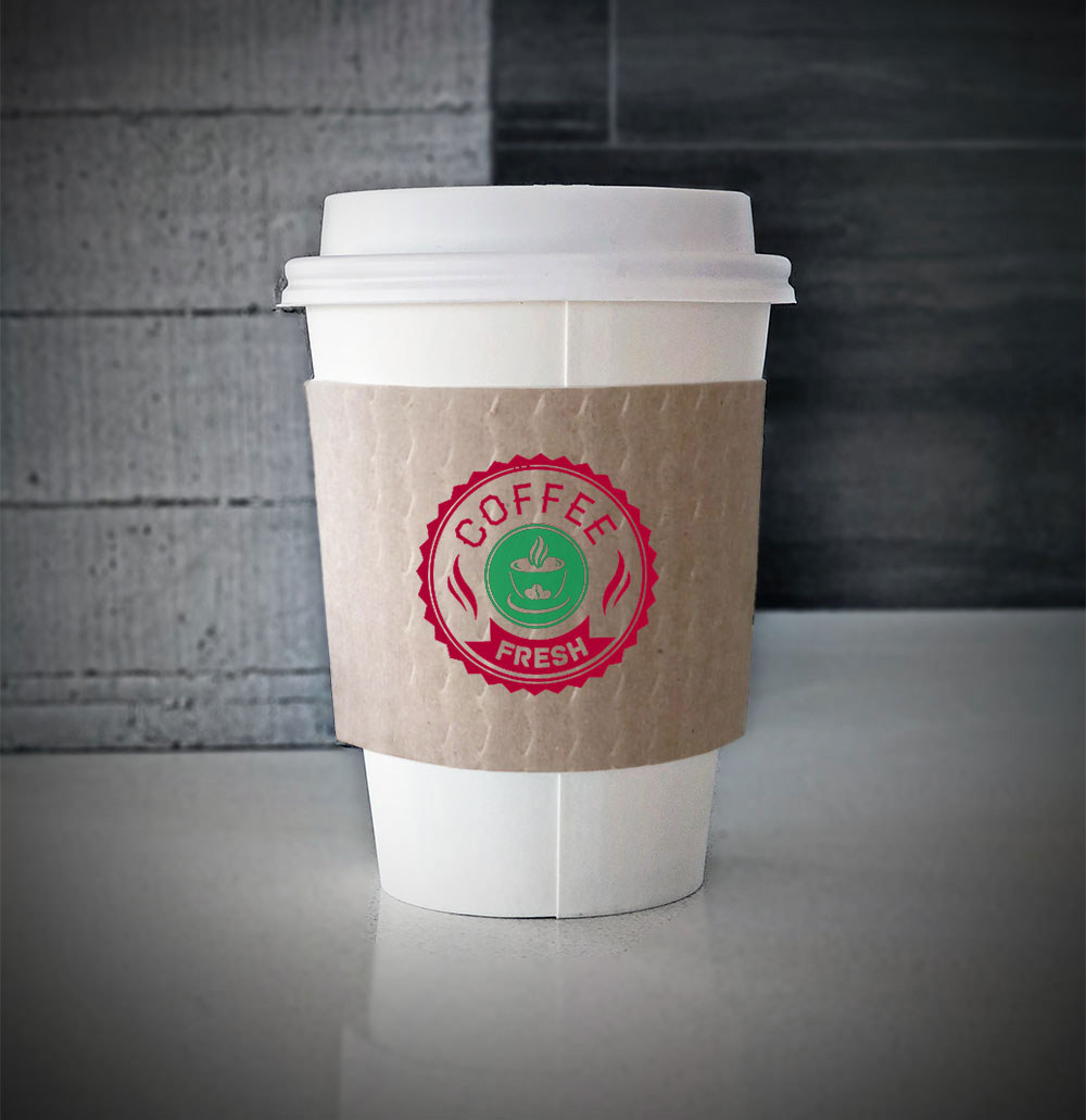 Custom printed coffee cup sleeves printed on kraft sleeves with two colors on front placed on a white paper cup and placed on countertop