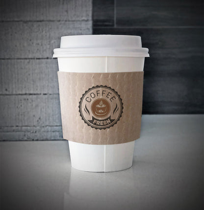 Custom coffee cup sleeves printed on kraft sleeves with two colors on front placed on a white paper cup on a countertop.